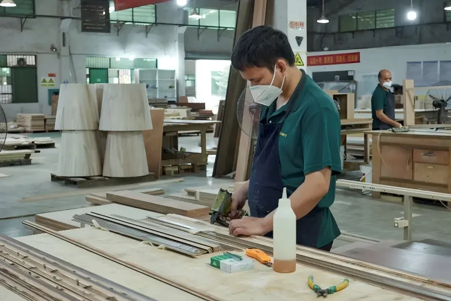 Wood cutting and CNC processing in furniture factory