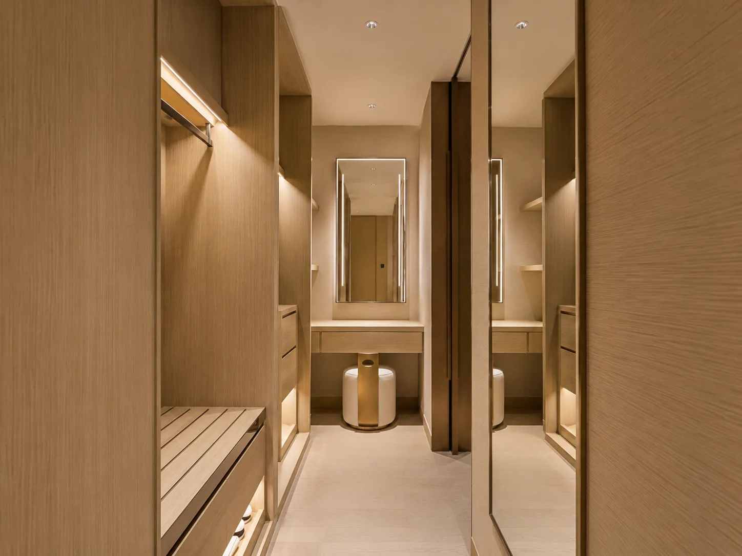 Built-in hotel wardrobe integrated into guestroom wall