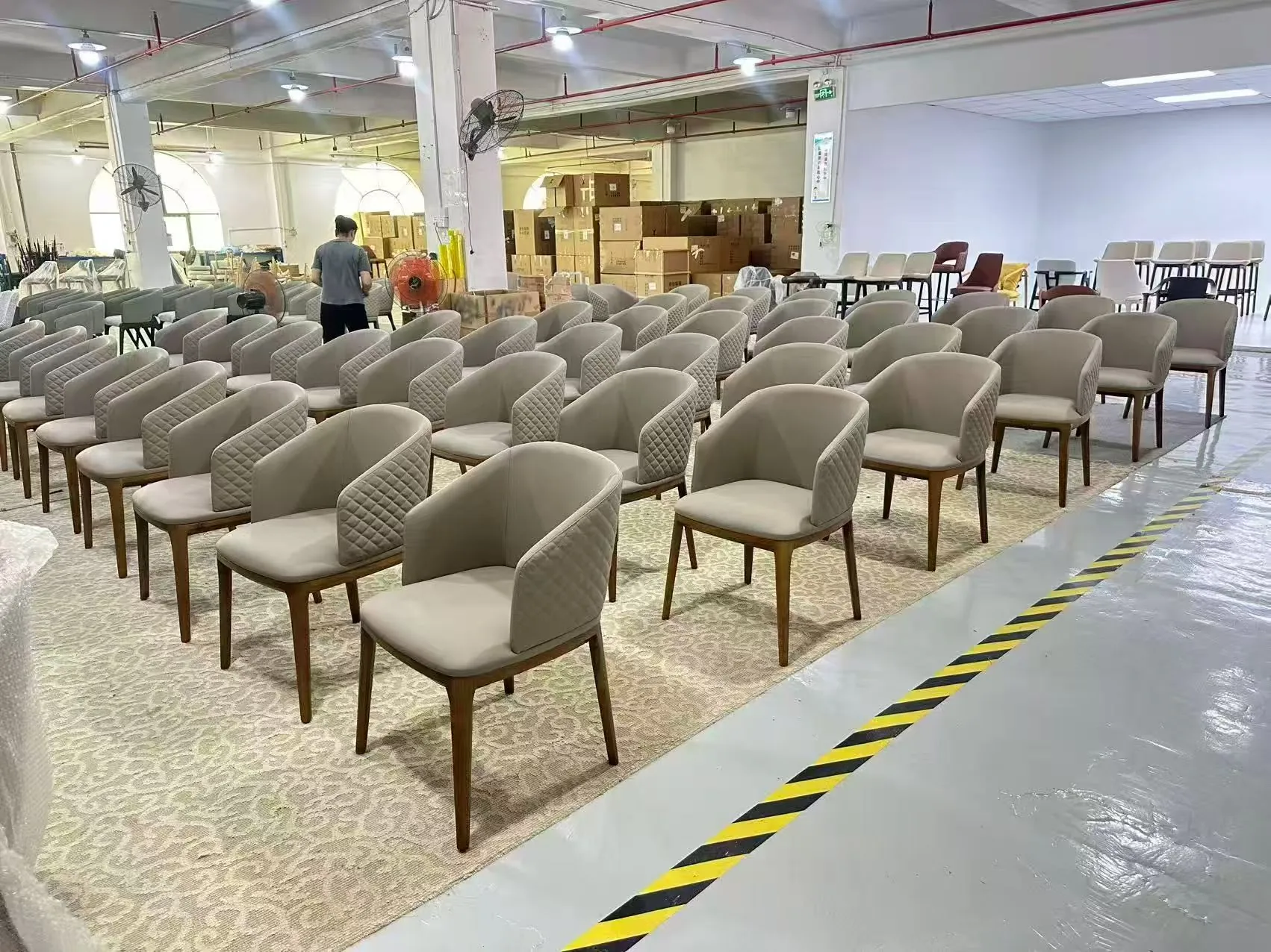 Bulk hotel chairs prepared for packing